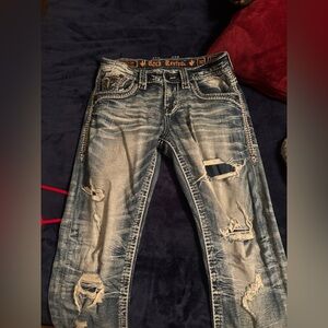 estoy vendiendo estos pantalones rock revival son talla 30by32